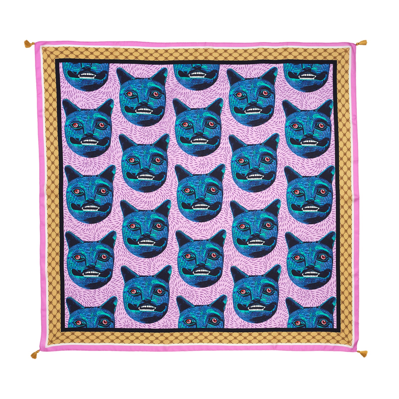 Patterned fabric with blue cat faces on a pink background