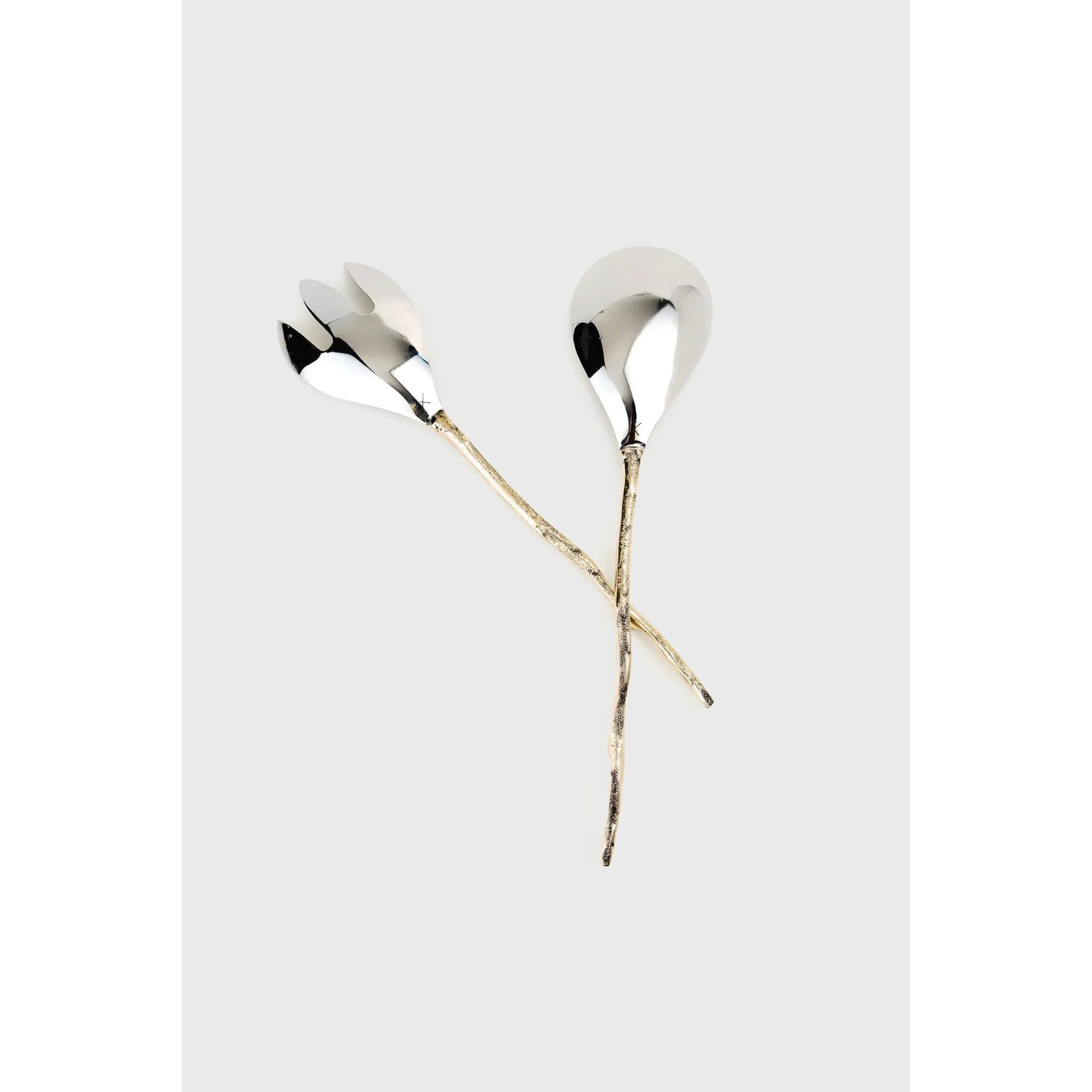 Silver hair accessories with gold accents on a light gray background