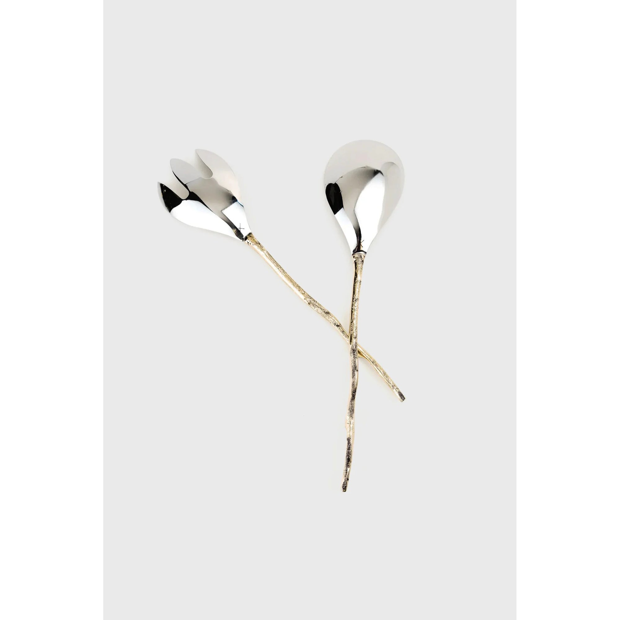 Pair of silver earrings with long gold stems on a light gray background