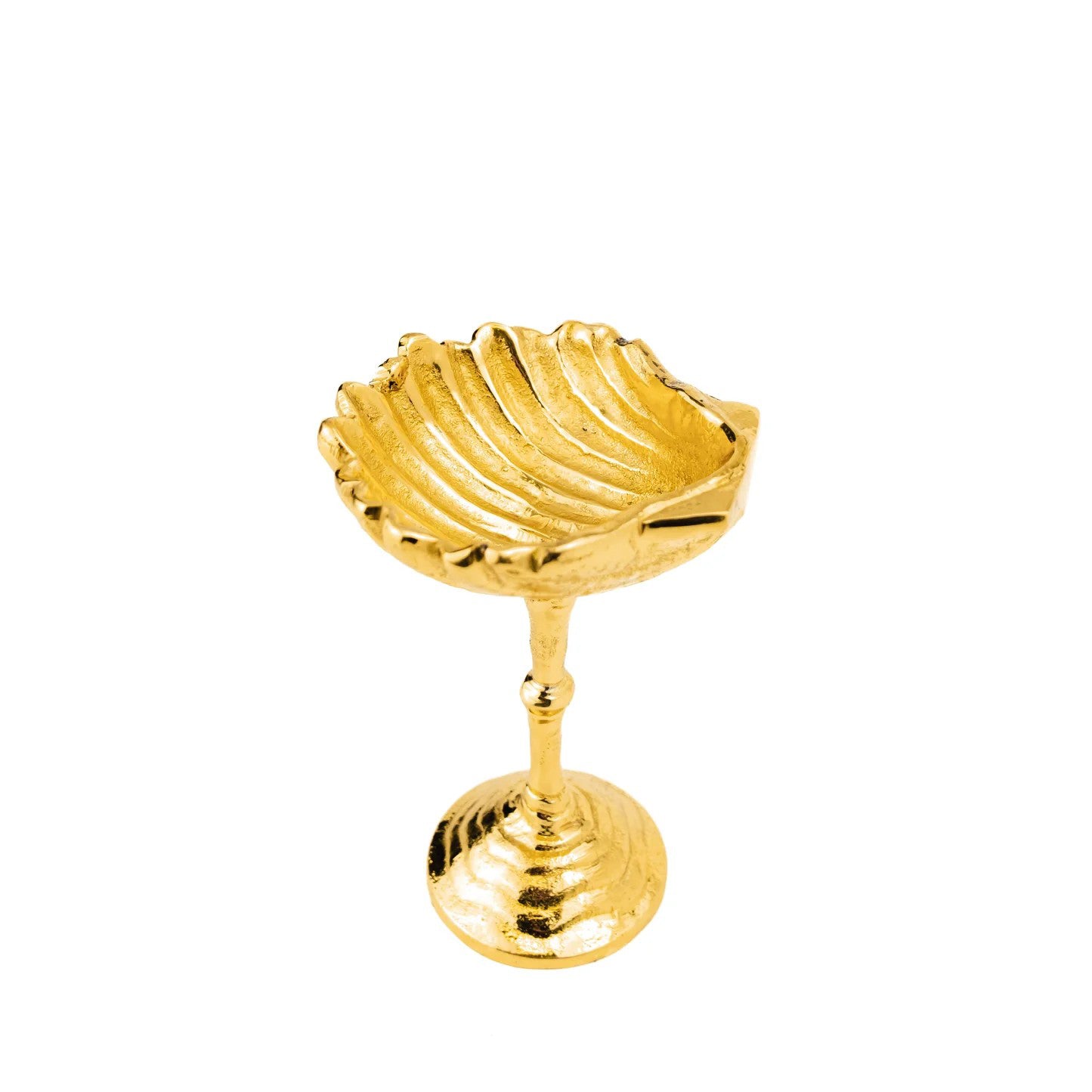 Gold shell-shaped dish on a white background