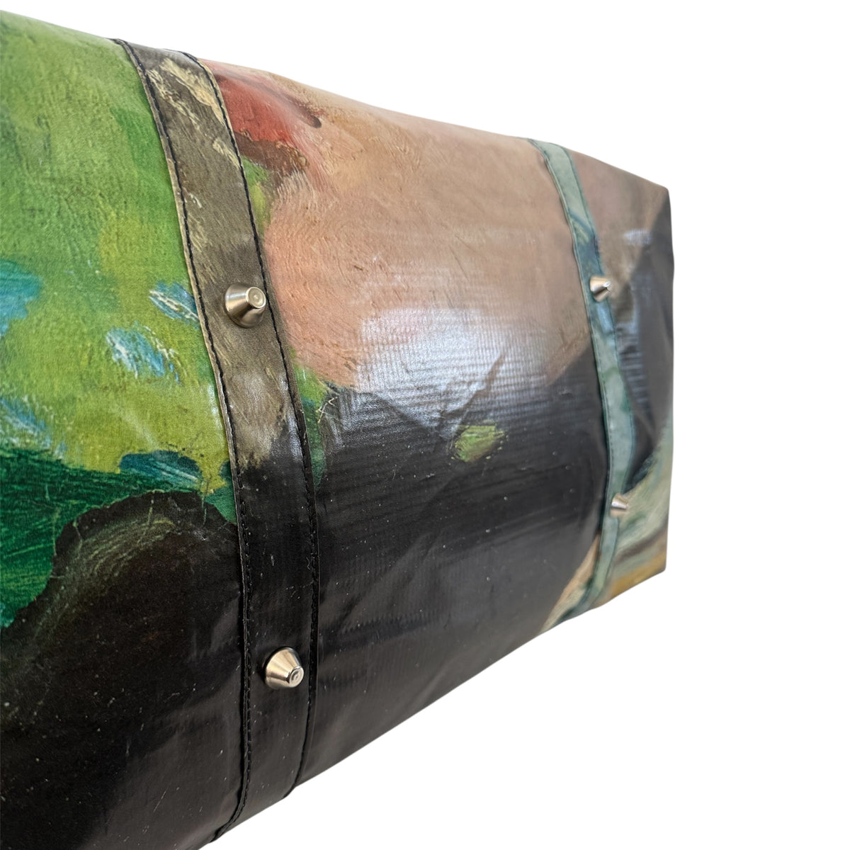Roll of fabric with a colorful pattern on a white background
