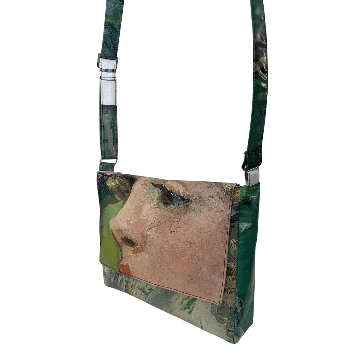Crossbody bag with a printed design of a face on a white background