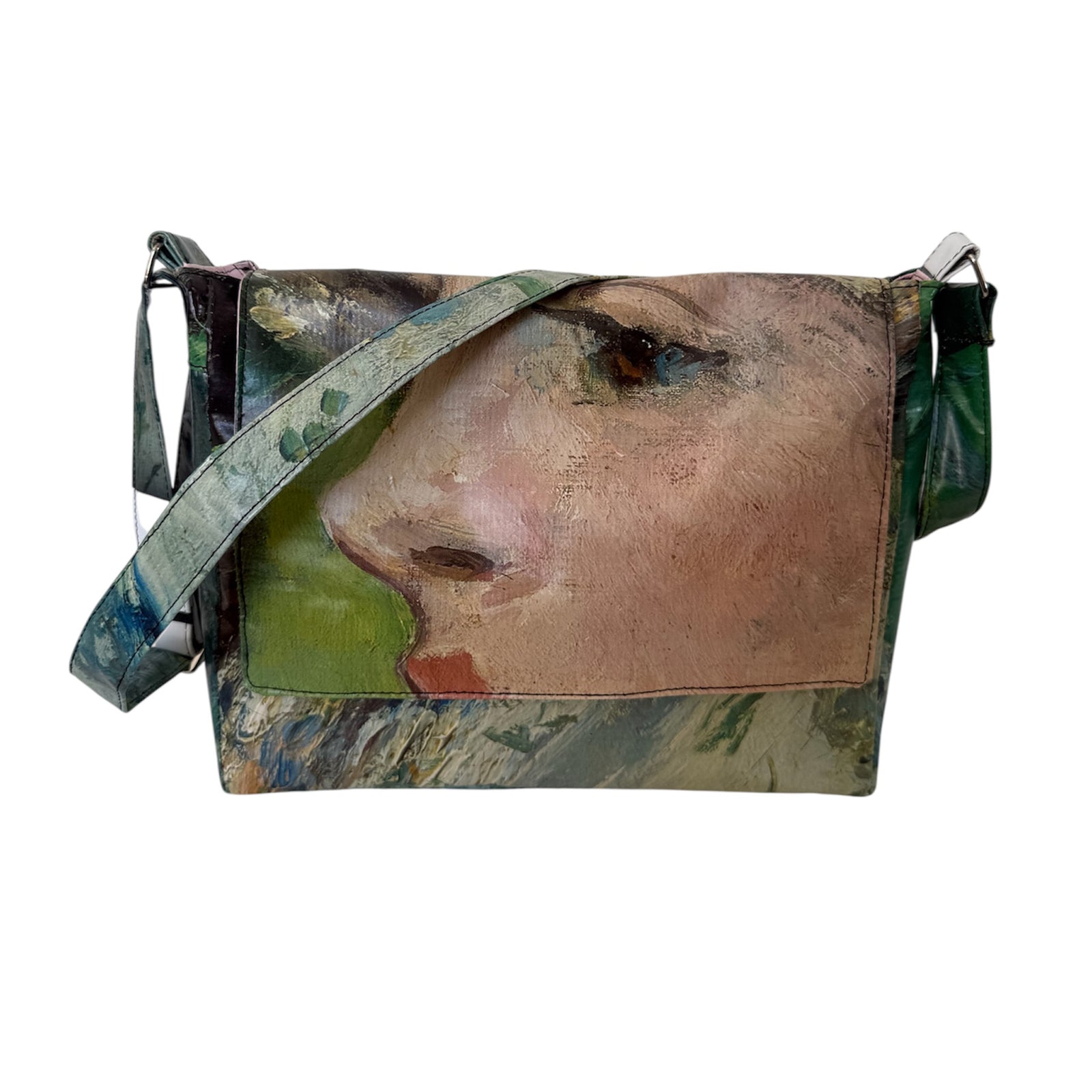 Handbag with artistic design of a face on a white background