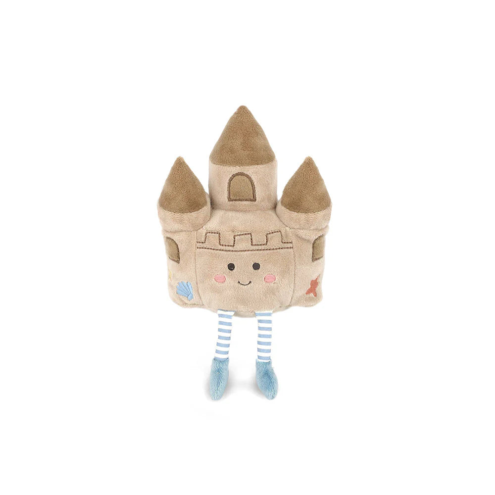 Plush toy shaped like a sandcastle with a smiling face on a white background