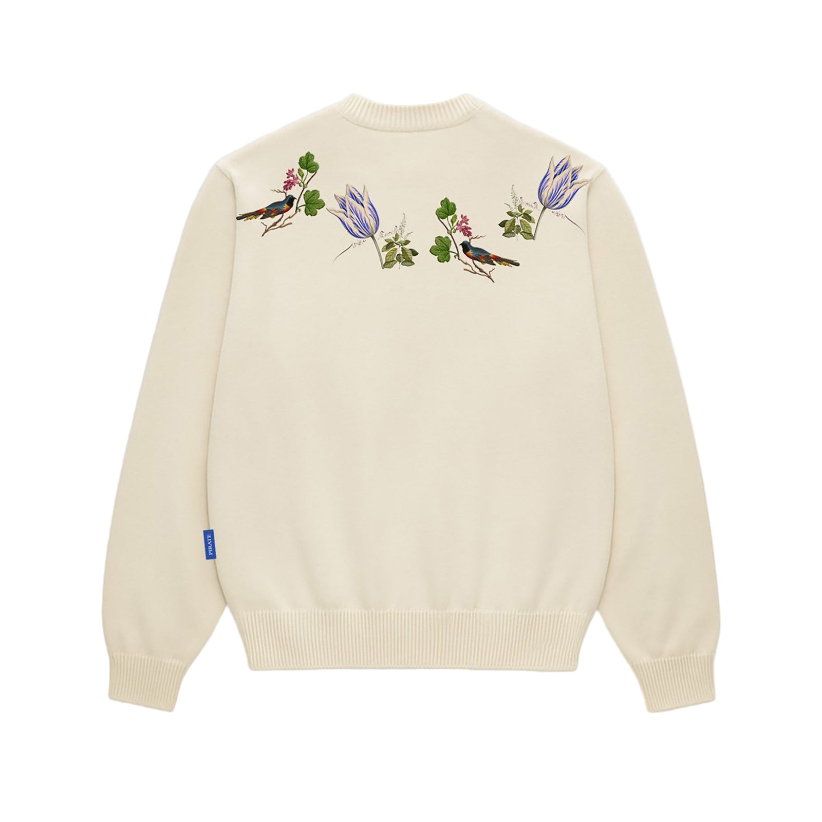 Cream sweater with floral and bird embroidery on a white background