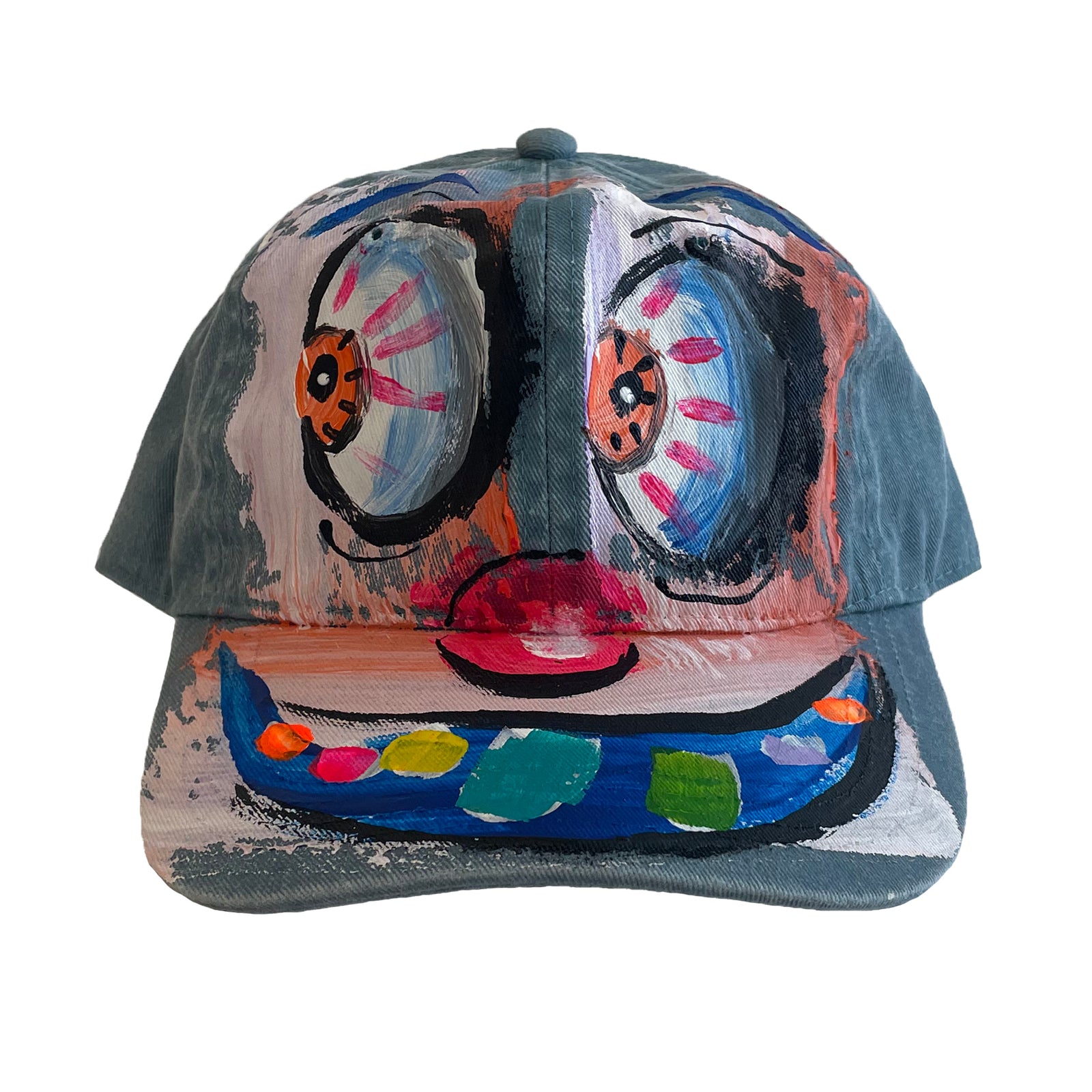 Colorful face design on a cap against a white background