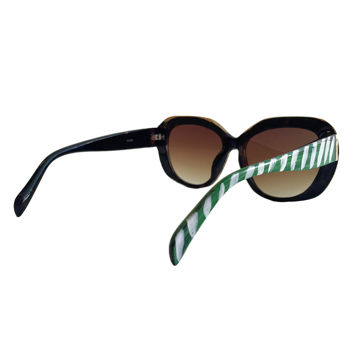 Sunglasses with a green and white striped arm on a white background