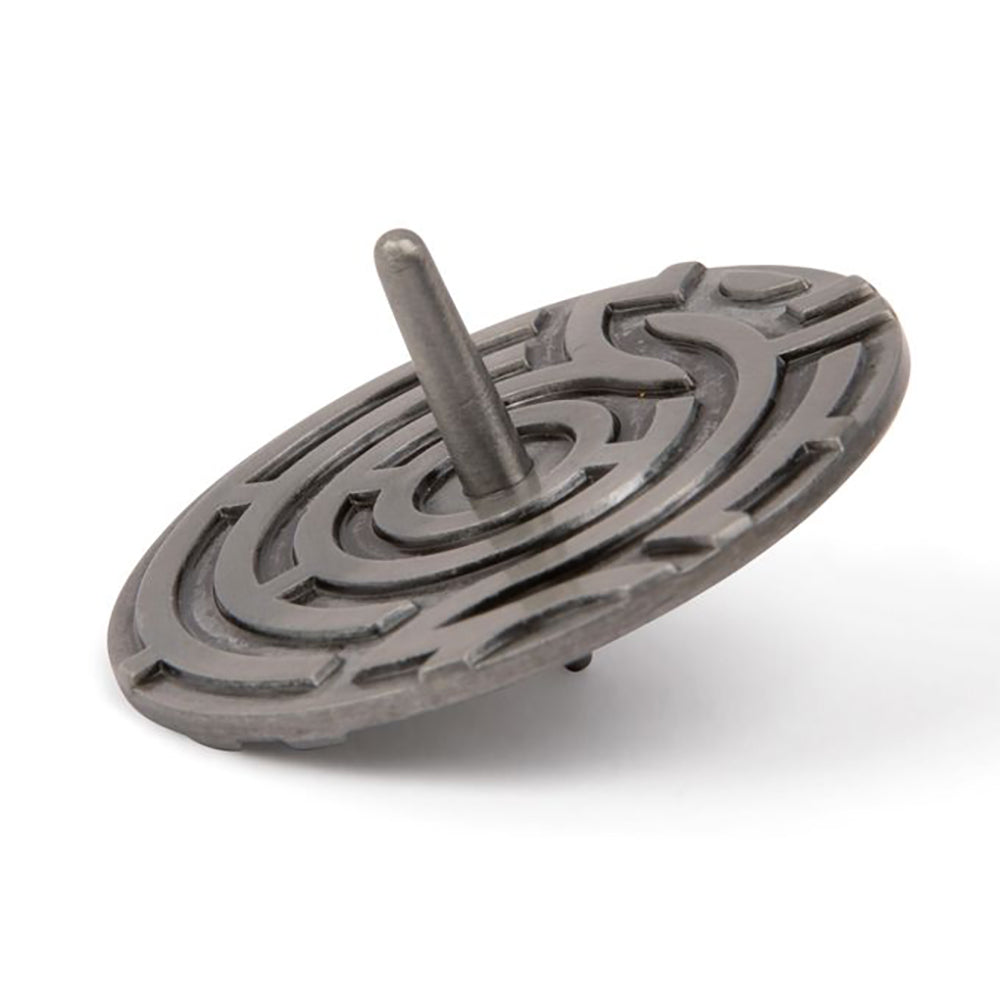 A silver finish metal spinning top with an embossed maze pattern.