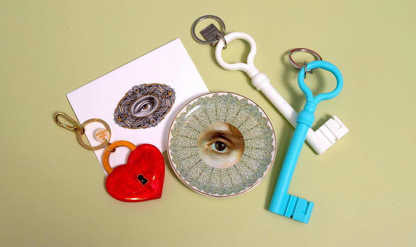 Decorative keys and a keychain on a light green background