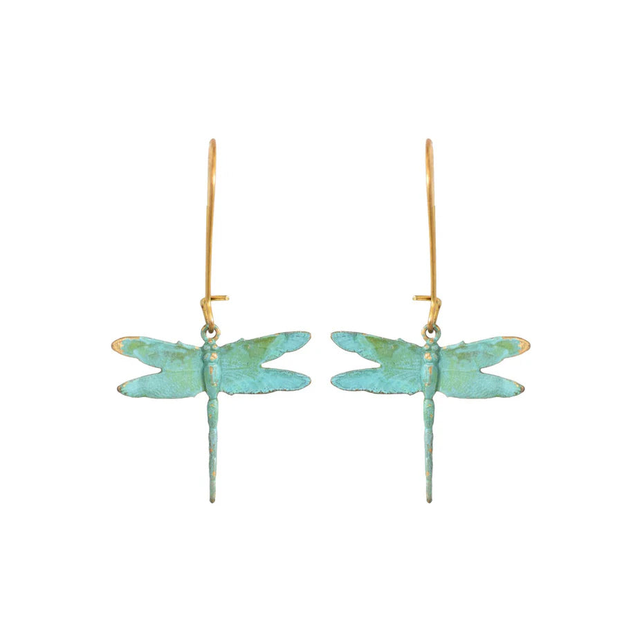Dragonfly-shaped earrings on gold hooks against a white background
