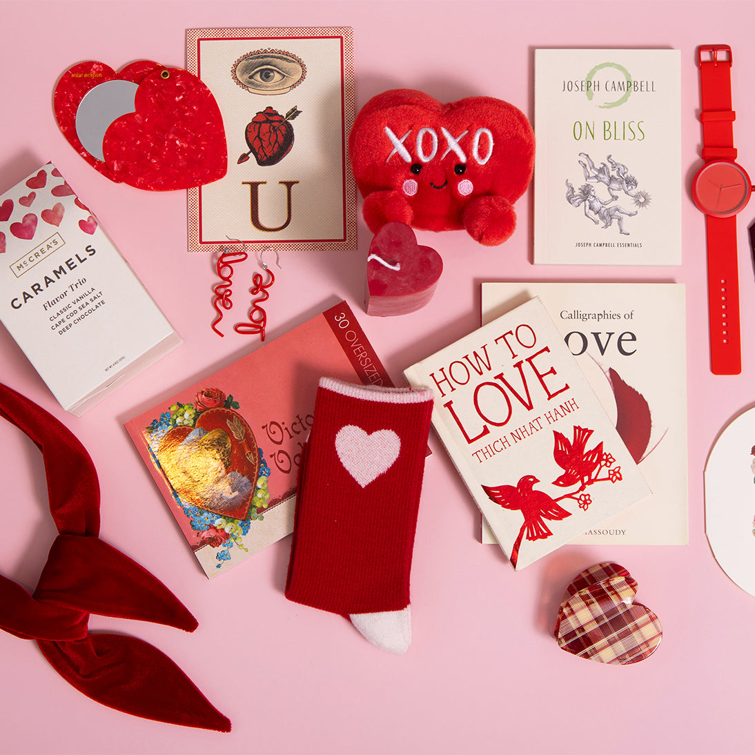 Collection of Valentine's Day-themed items on a pink background