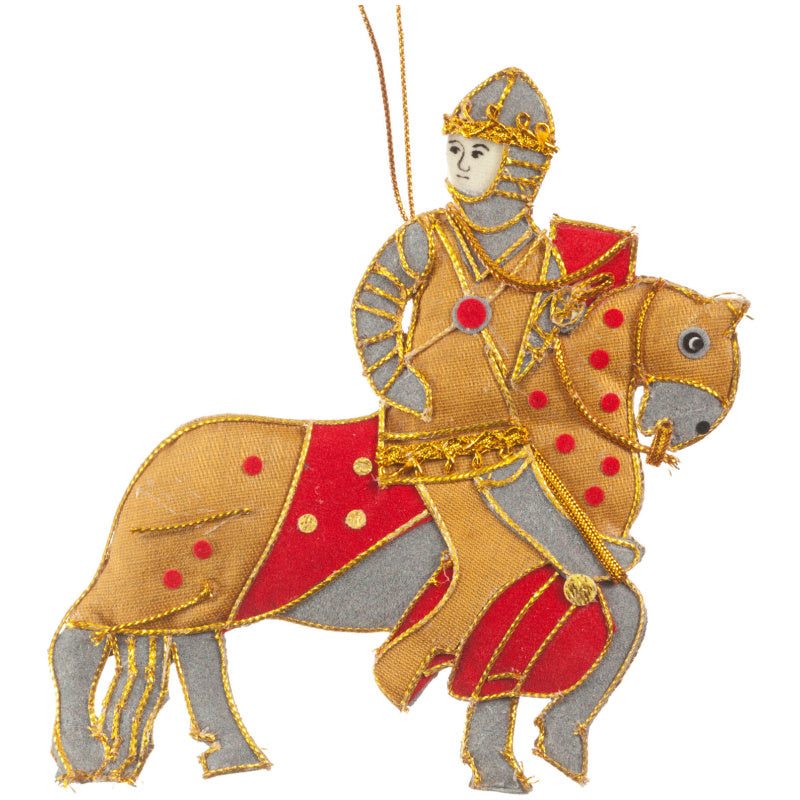 An embroidered hanging ornament depicting a knight in silver and gold armor riding a tan and red horse, shown on a plain white background.