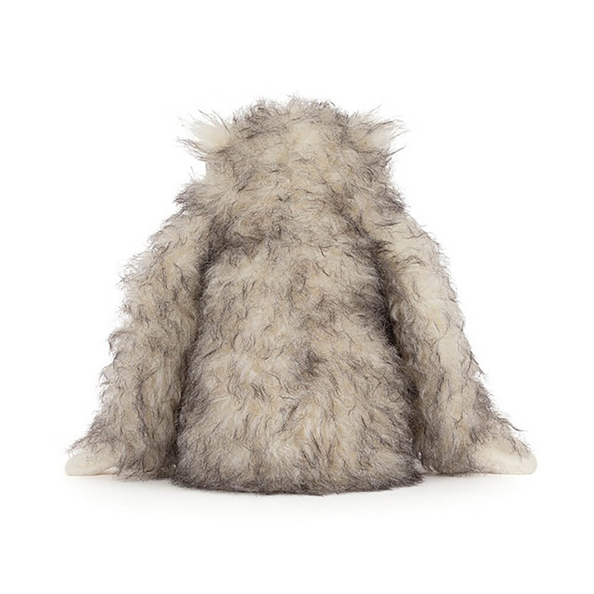 Plush toy resembling a wolf on a white background