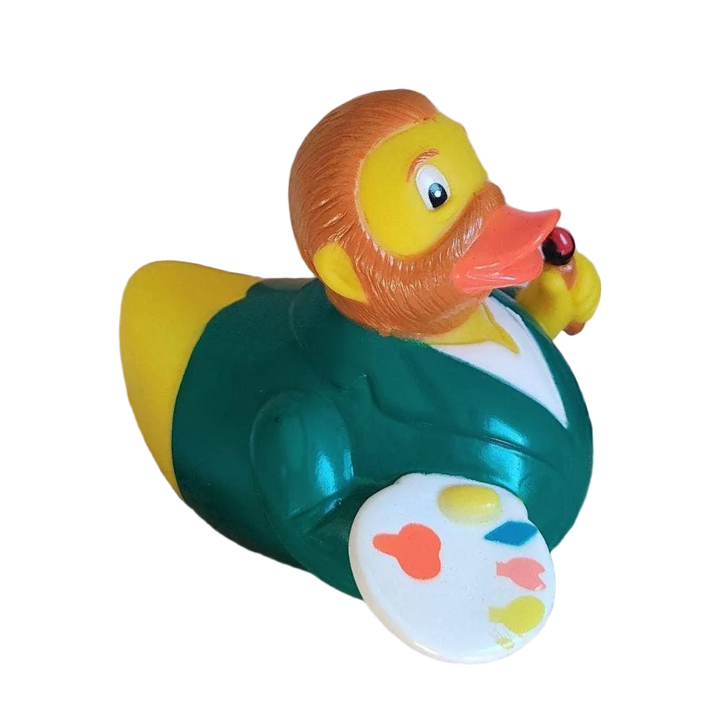 Colorful rubber duck with a paint palette on a cardboard surface