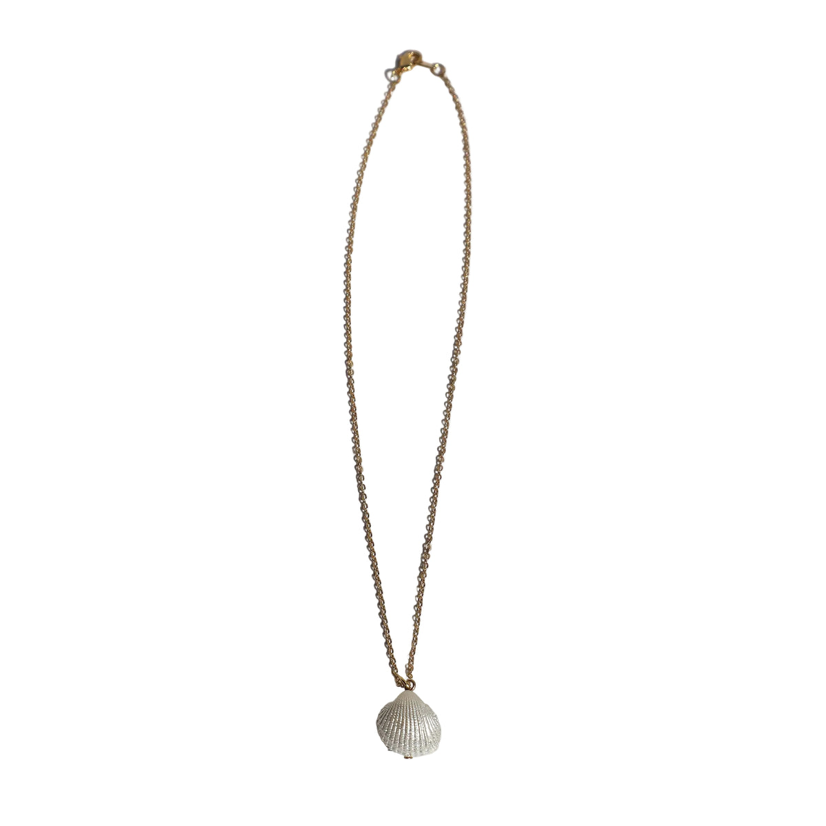 Thin gold chain necklace with a white shell pendant