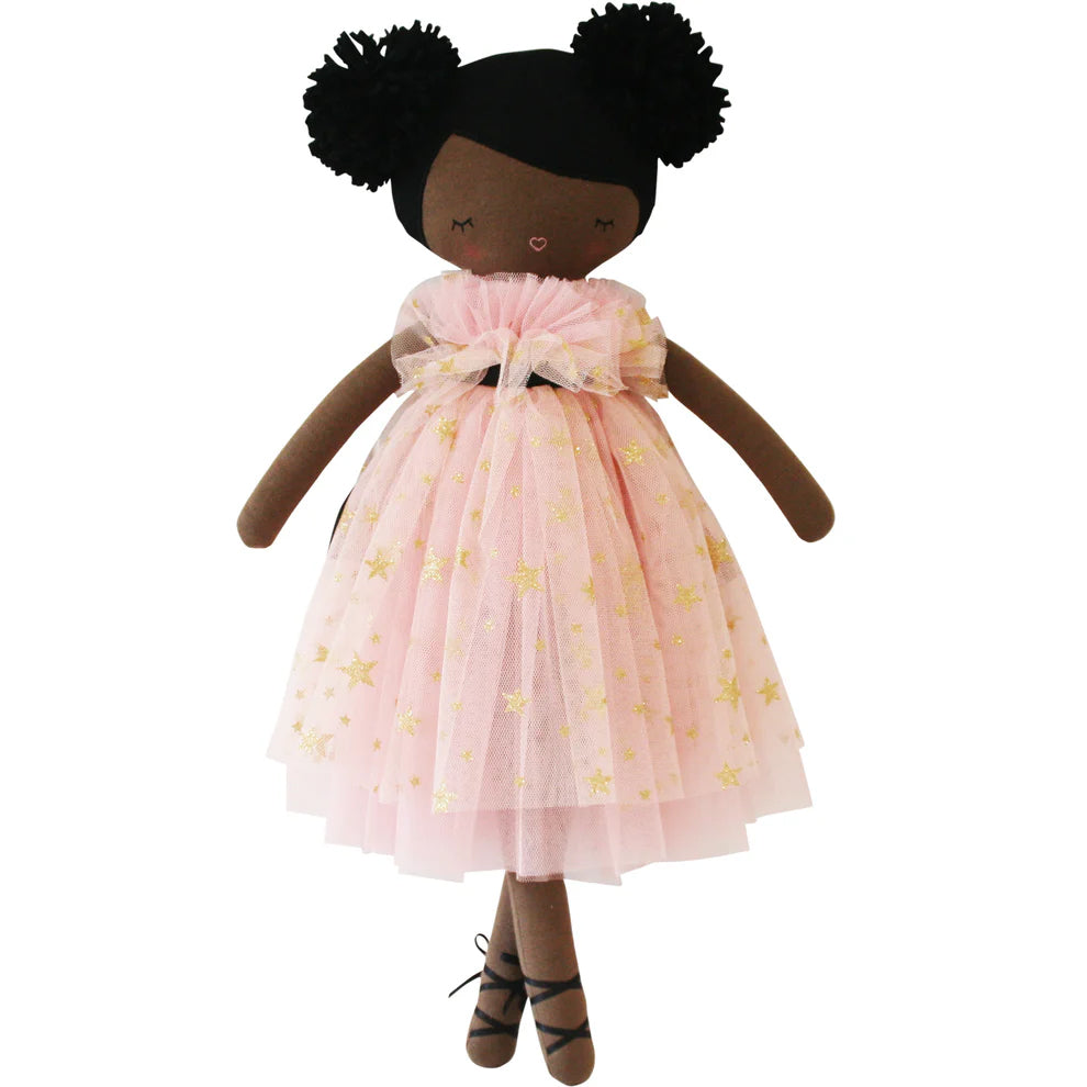 Doll with a pink dress featuring yellow stars on a white background