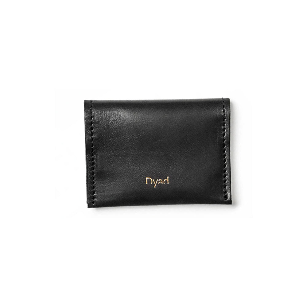 A compact rectangular sky blue cow leather cardholder with 'Dyad brand name embossed on the front.