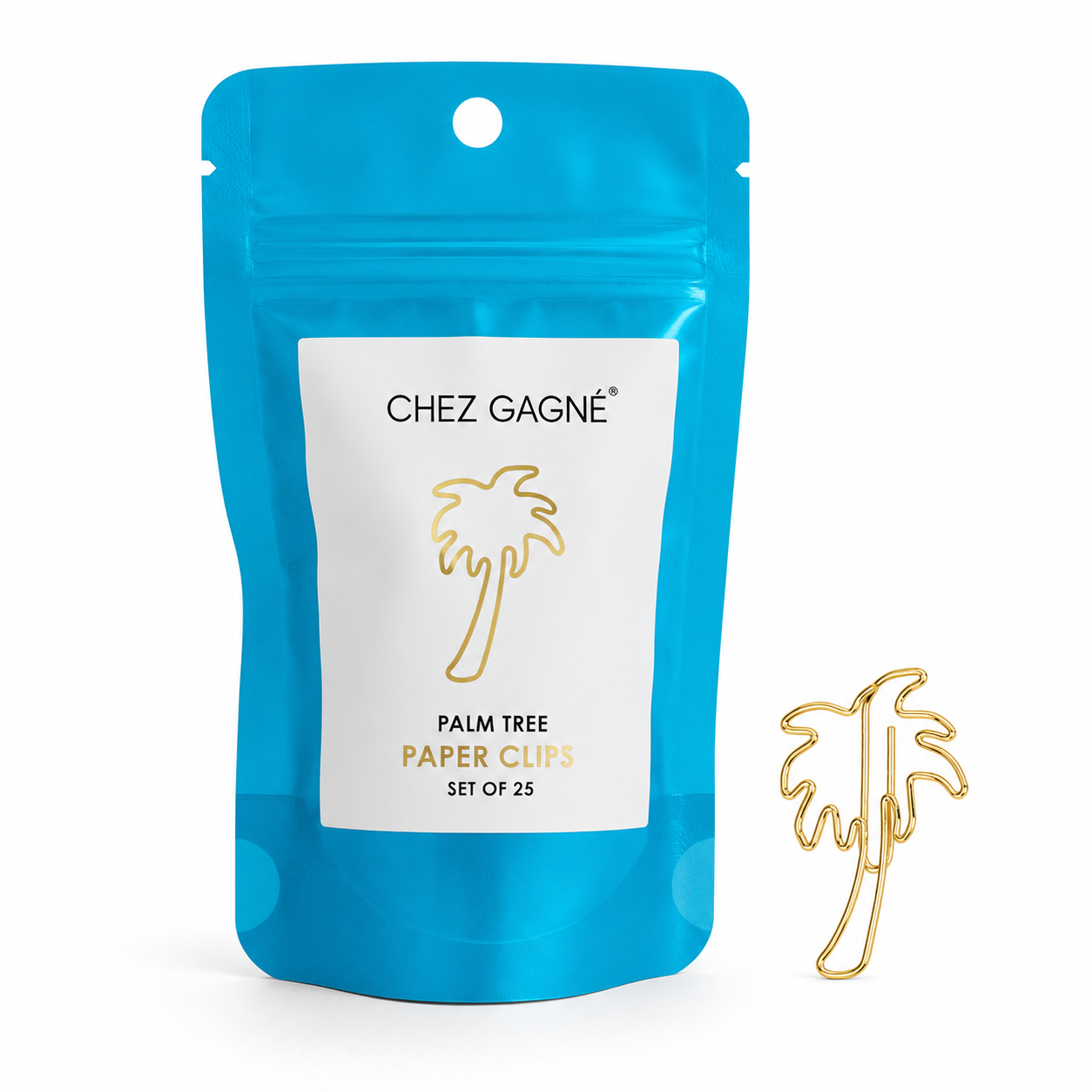 A bright blue resealable pouch labeled 'CHEZ GAGNÉE PALM TREE PAPER CLIPS SET OF 25' with a single gold paper clip shaped like a palm tree on a white background.