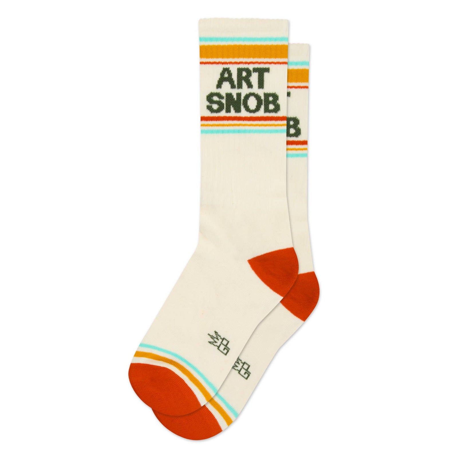 A pair of cream-colored crew socks with retro orange, yellow, and light blue stripes. The front sock features the text 'ART SNOB' in dark green.