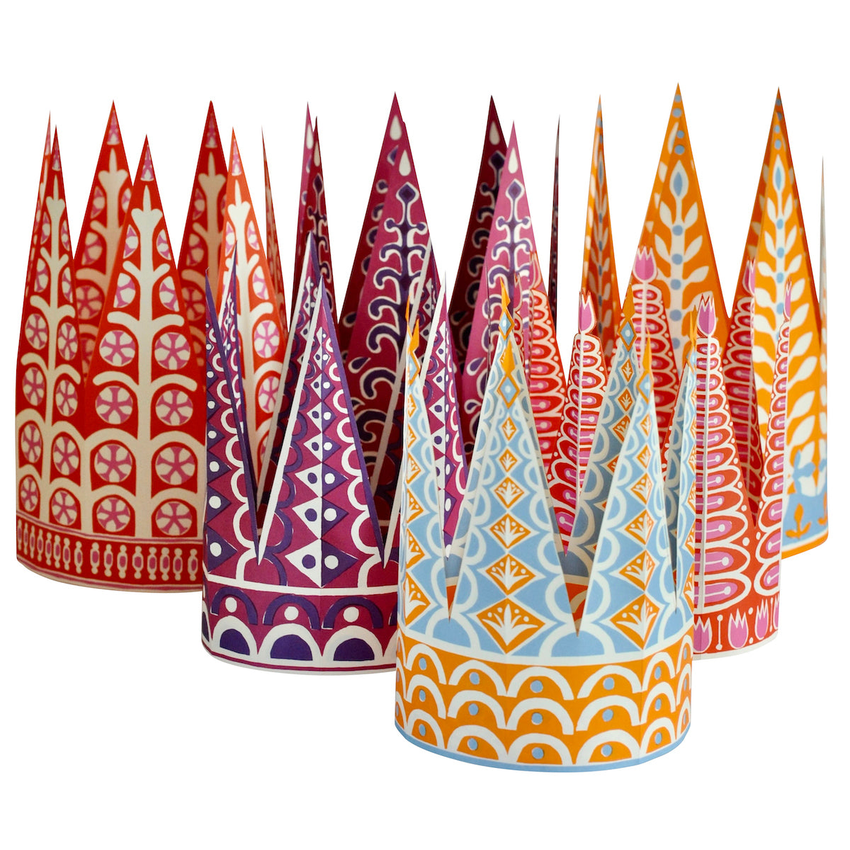 Set of colorful paper party crowns with geometric patterns on a white background
