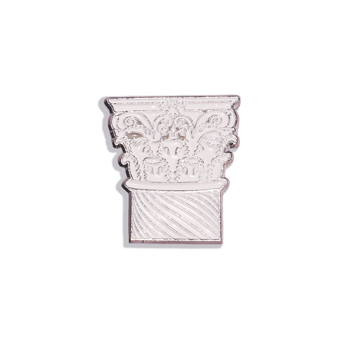 Decorative metal pin with intricate design on a white background