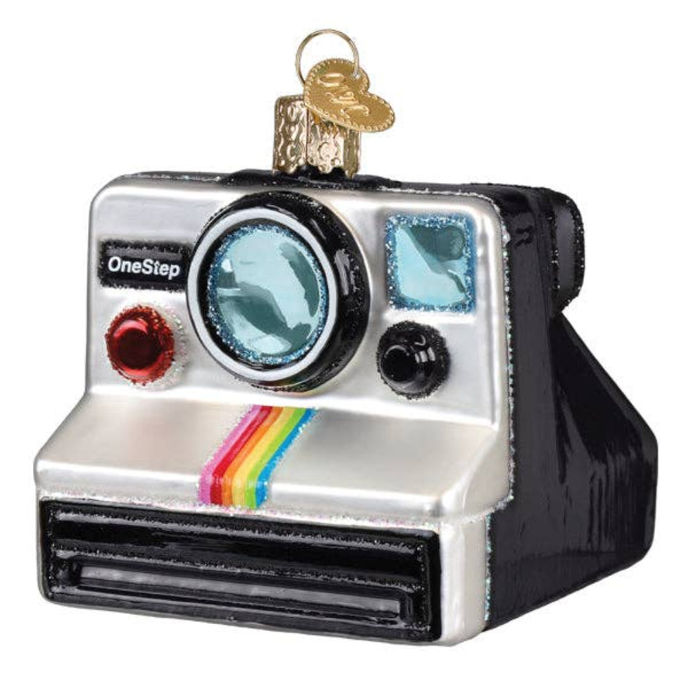 Decorative ornament shaped like a vintage camera with a rainbow stripe on a white background