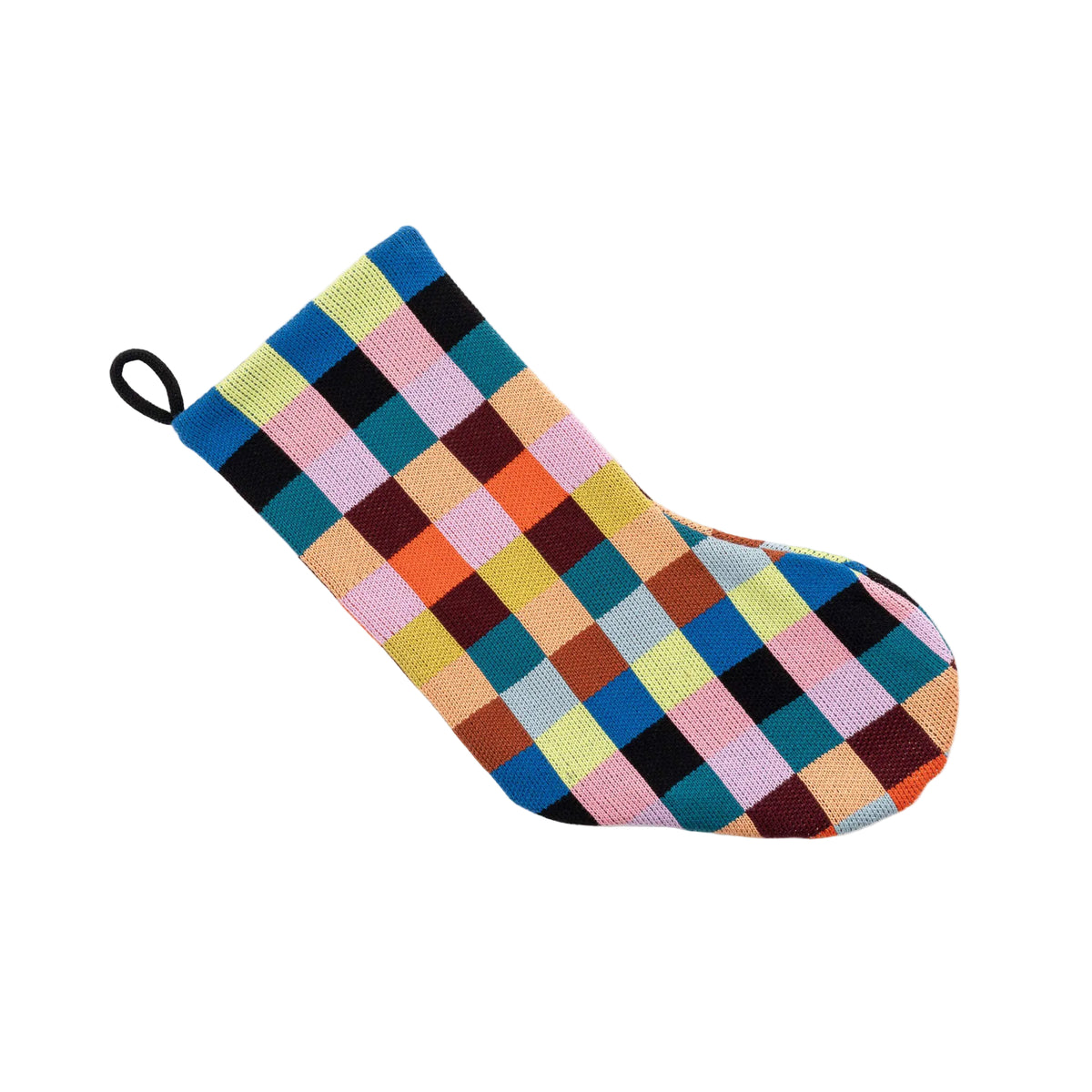 A single knit Christmas stocking with a colorful checkered pattern, featuring a black hanging loop at the top, set against a plain light gray background.