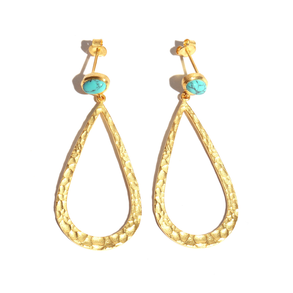 Gold earrings with turquoise stones on a white background