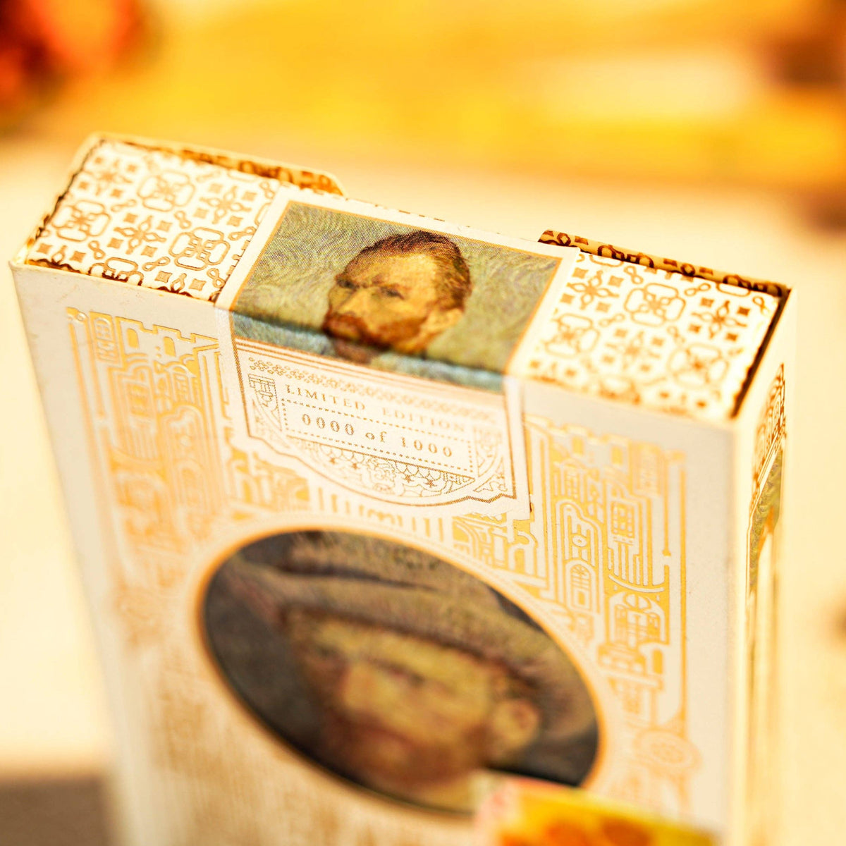 Small decorative box with portrait images on a blurred background