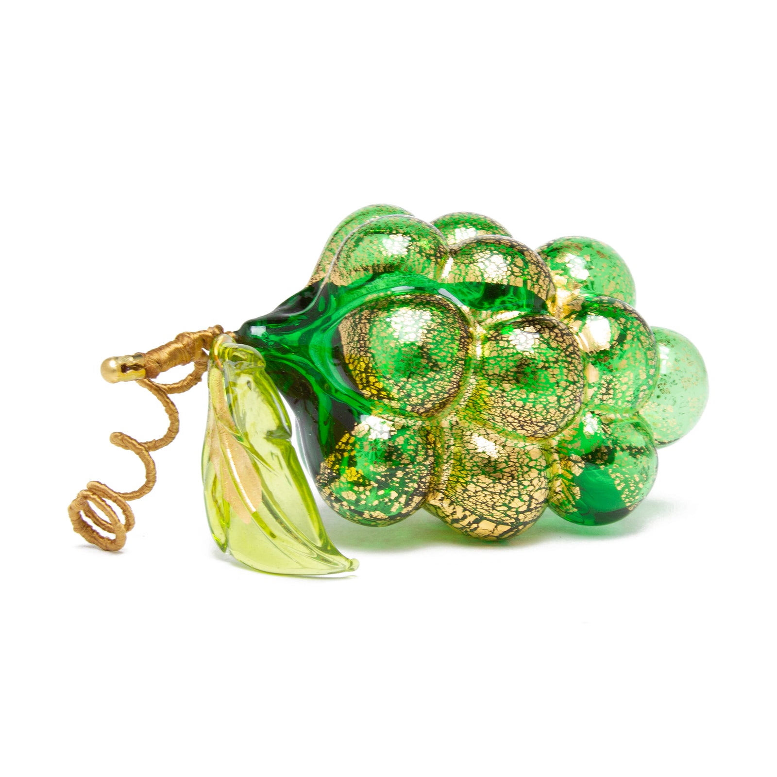 Green glass grapes with gold accents on a white background