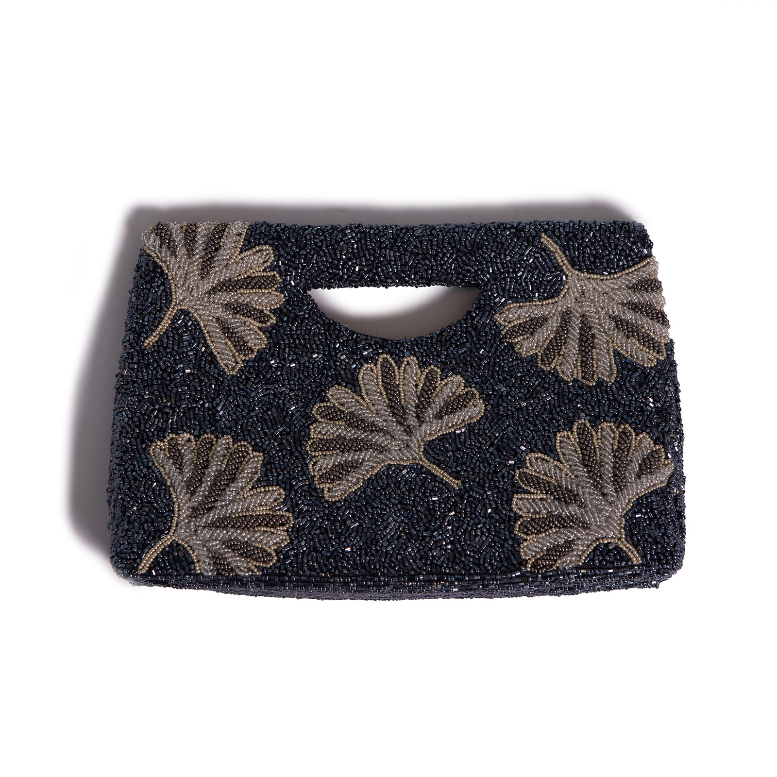 Black clutch bag with leaf patterns on a white background