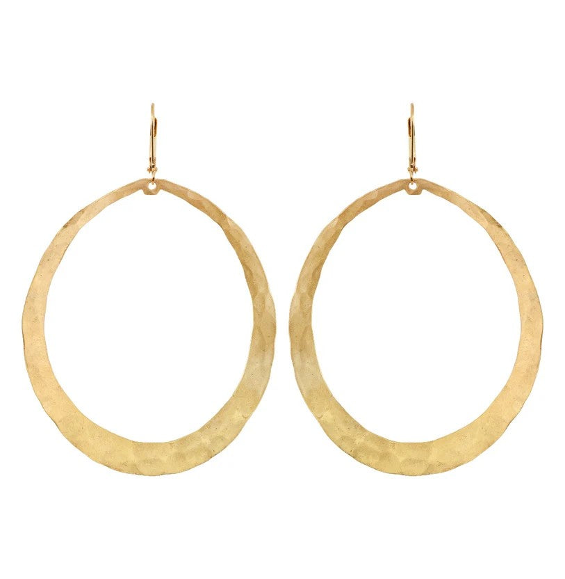 A pair of hammered gold-tone oval hoop earrings with fishhook backings, displayed against a solid white background.