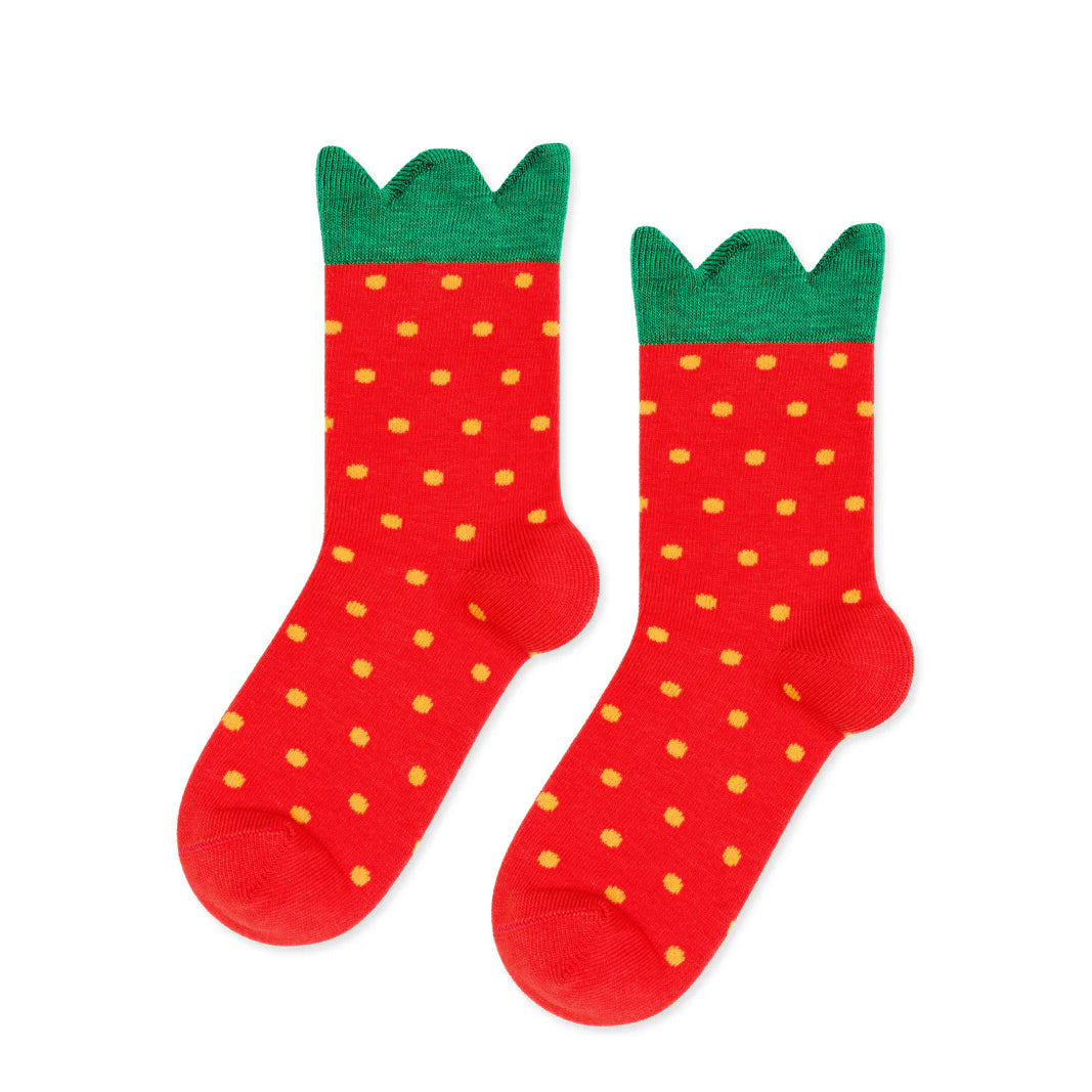 Red socks with green tops resembling strawberries on a white background