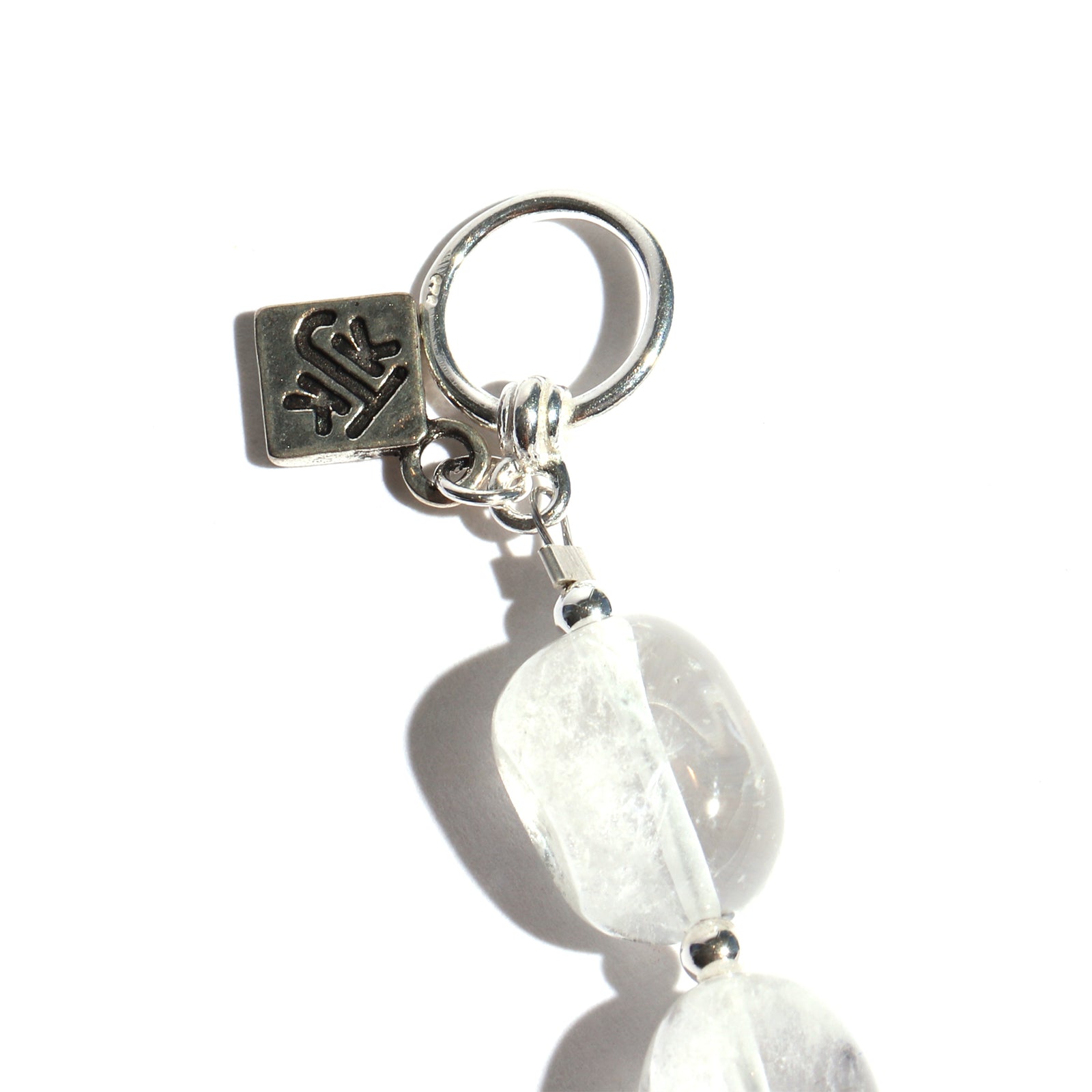 Bracelet with white quartz on a white background