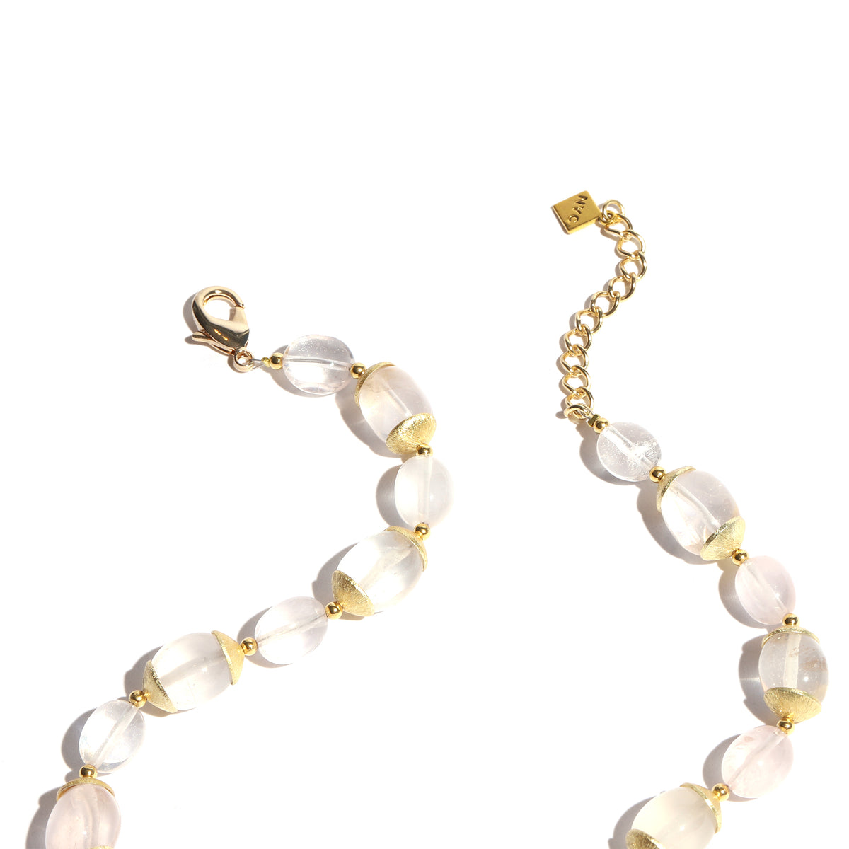Necklace with white beads and gold accents on a white background