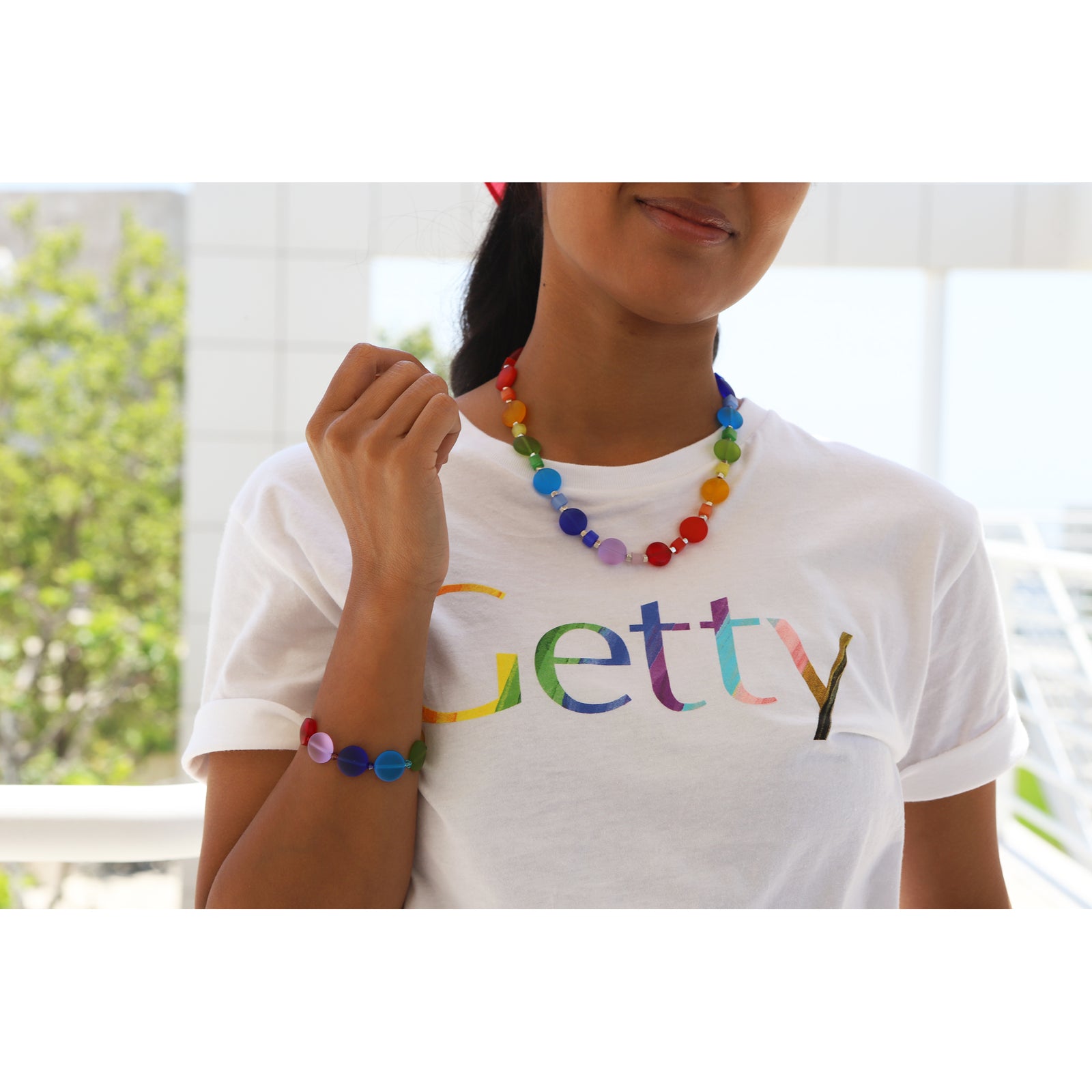 Colorful beaded bracelet with a silver clasp on a white background