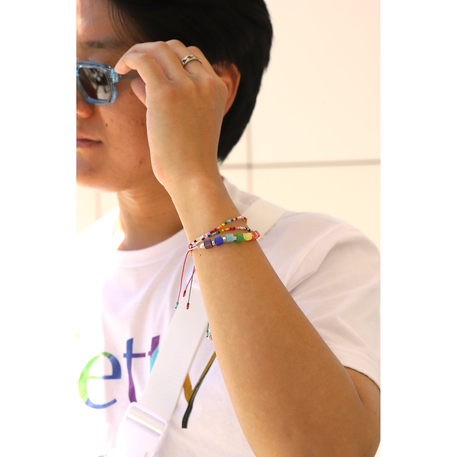Necklace with colorful square beads on a white background