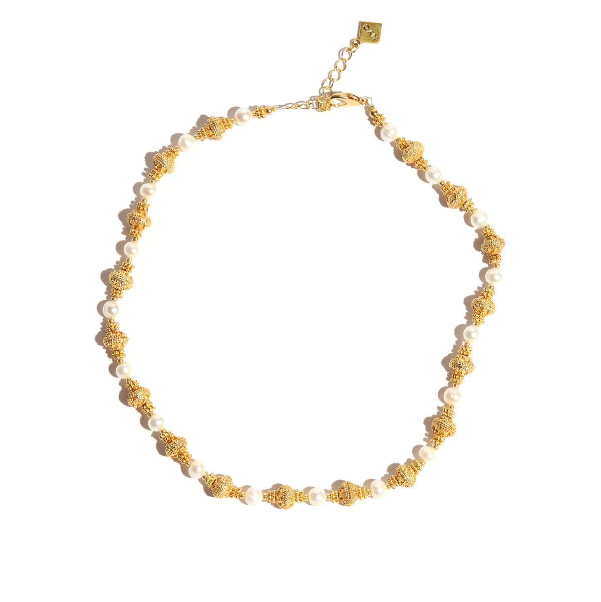 Necklace with gold and pearl beads on a white background