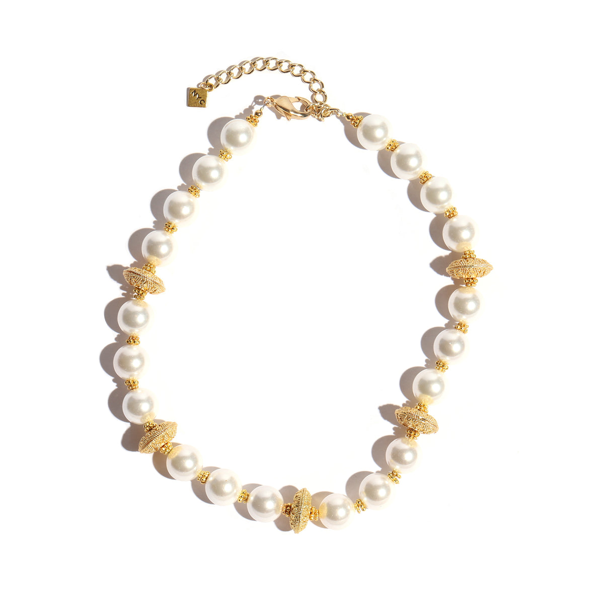 Pearl necklace with gold accents on a white background