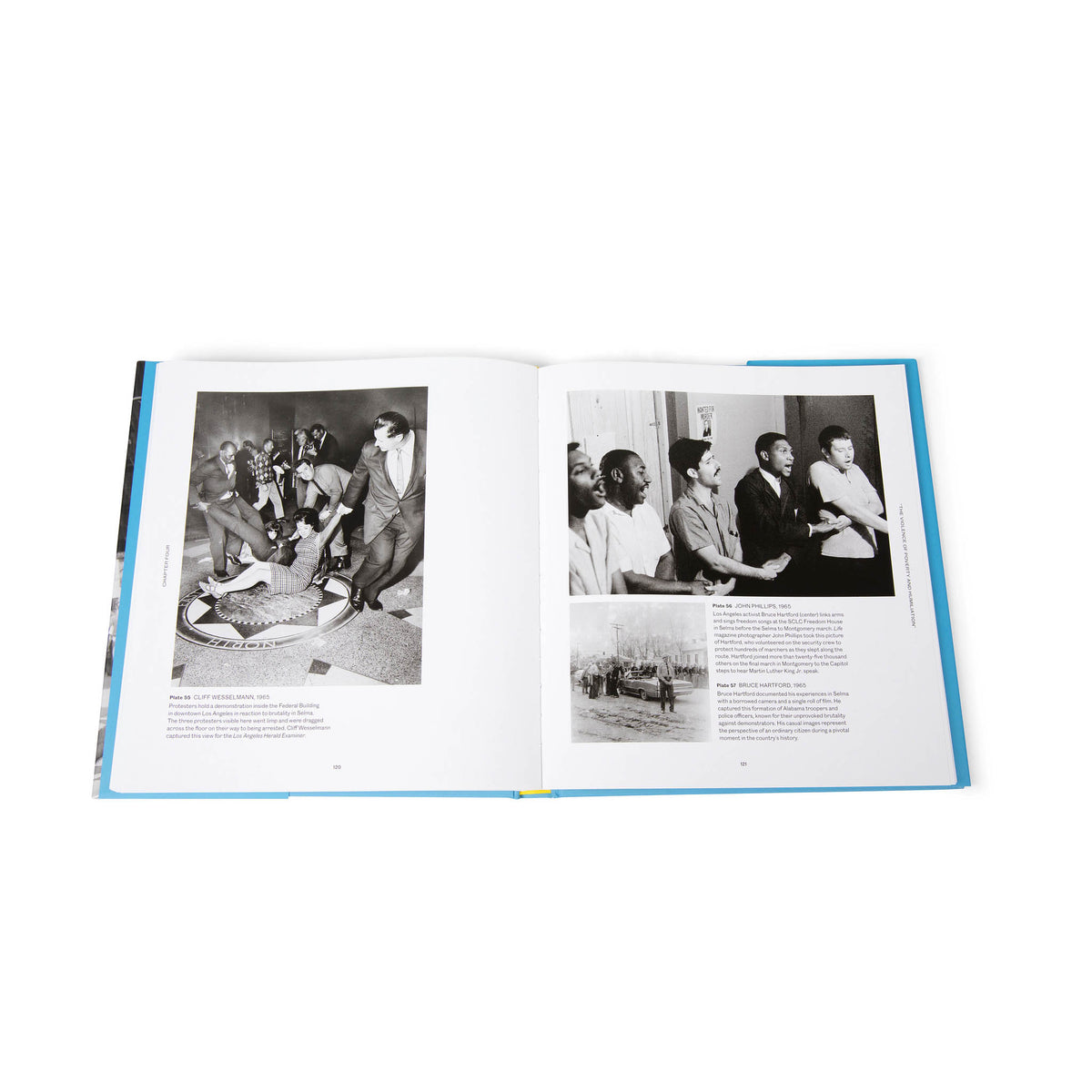 Open book with black and white photographs and text on a white background