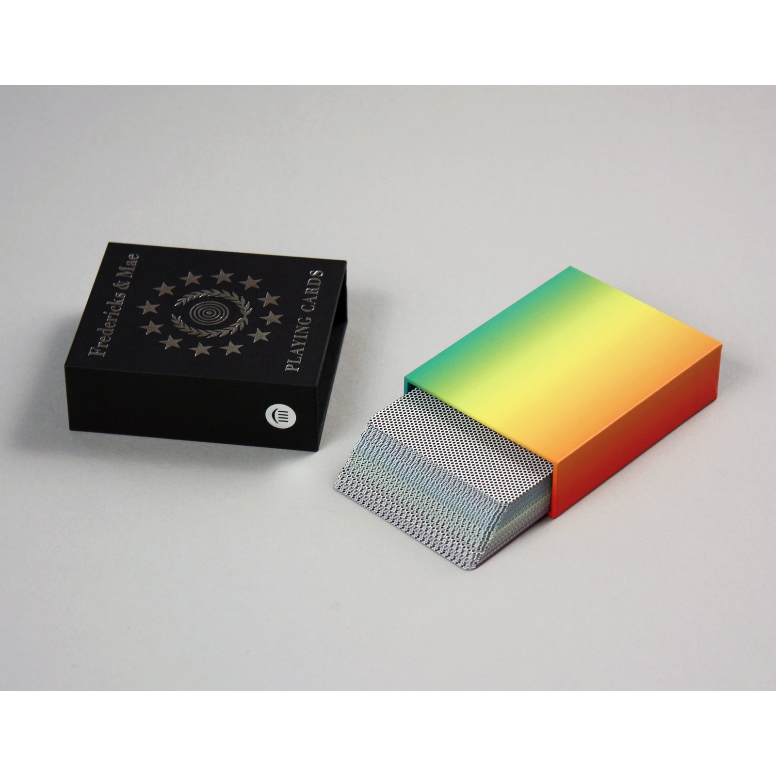 Color Spectrum Playing Cards displayed in a rainbow formation above the black and white packaging