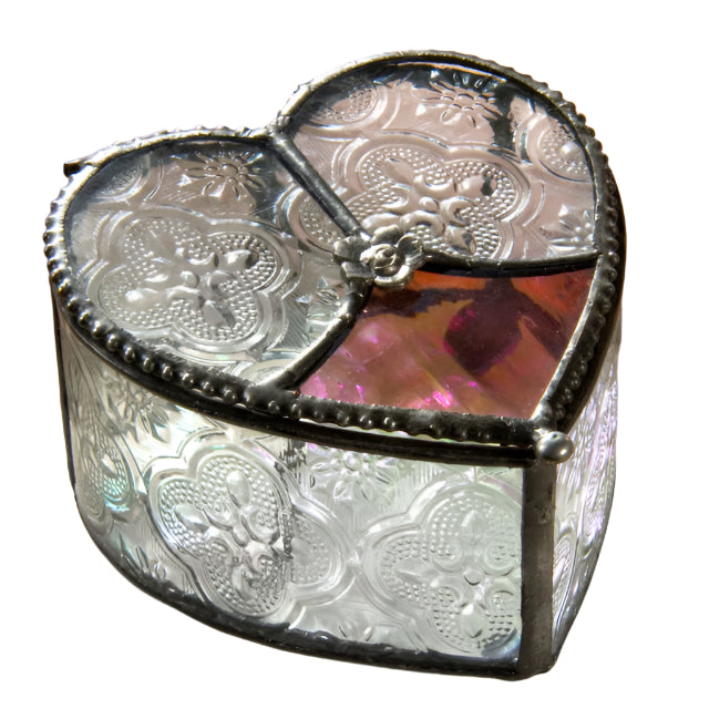 Heart-shaped glass box with floral details and metal framing. Mostly clear with a bit of pink glass