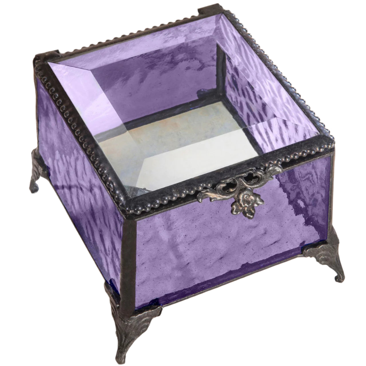 A vintage-style glass jewelry box with purple stained glass, metal trim, and decorative metal feet. 