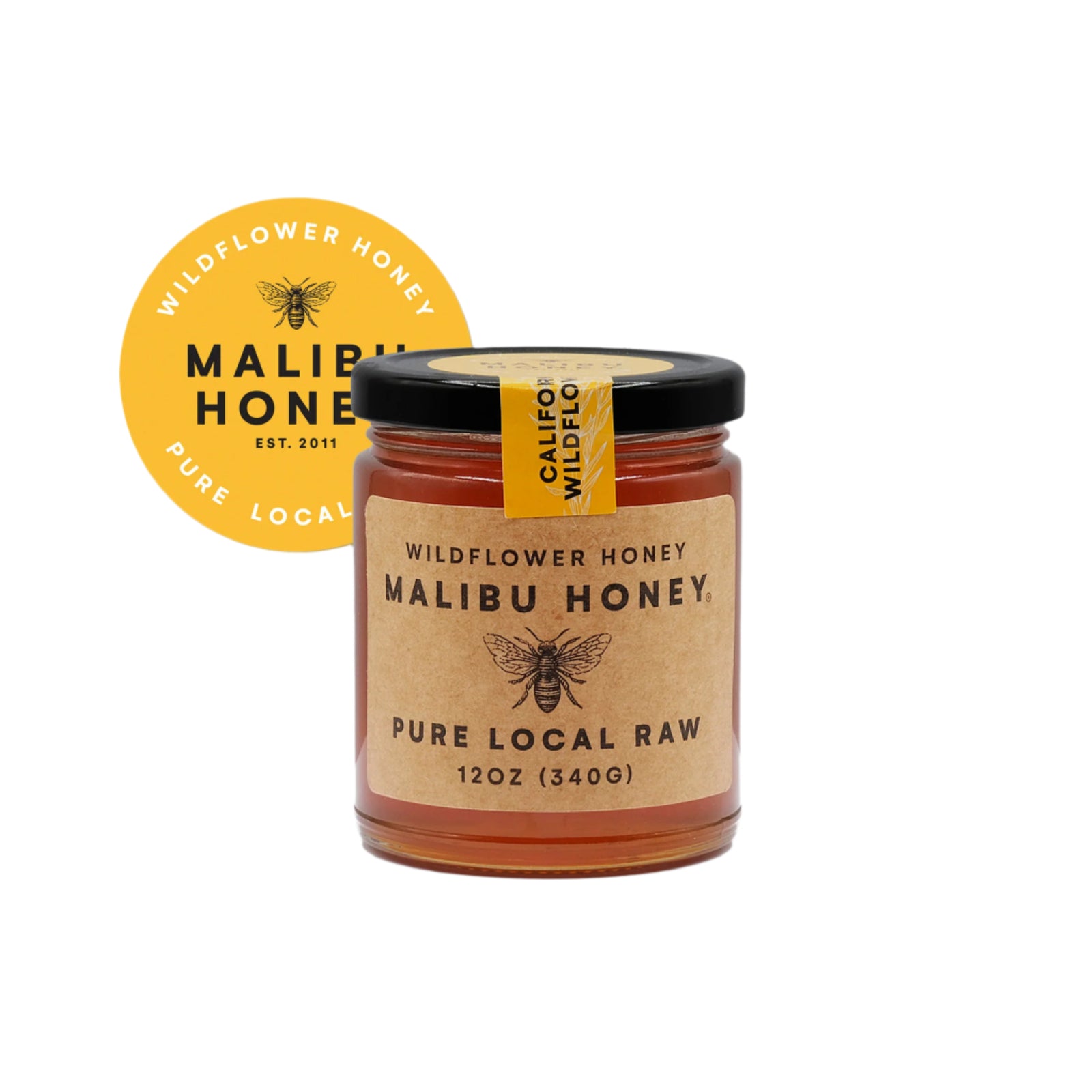 A jar of Malibu Honey with a label that reads 'Wildflower Honey Malibu Honey - Pure Local Raw' and has a weight indication of '12 oz (340g)'. There is also a yellow round logo with 'Malibu Honey' written on it.