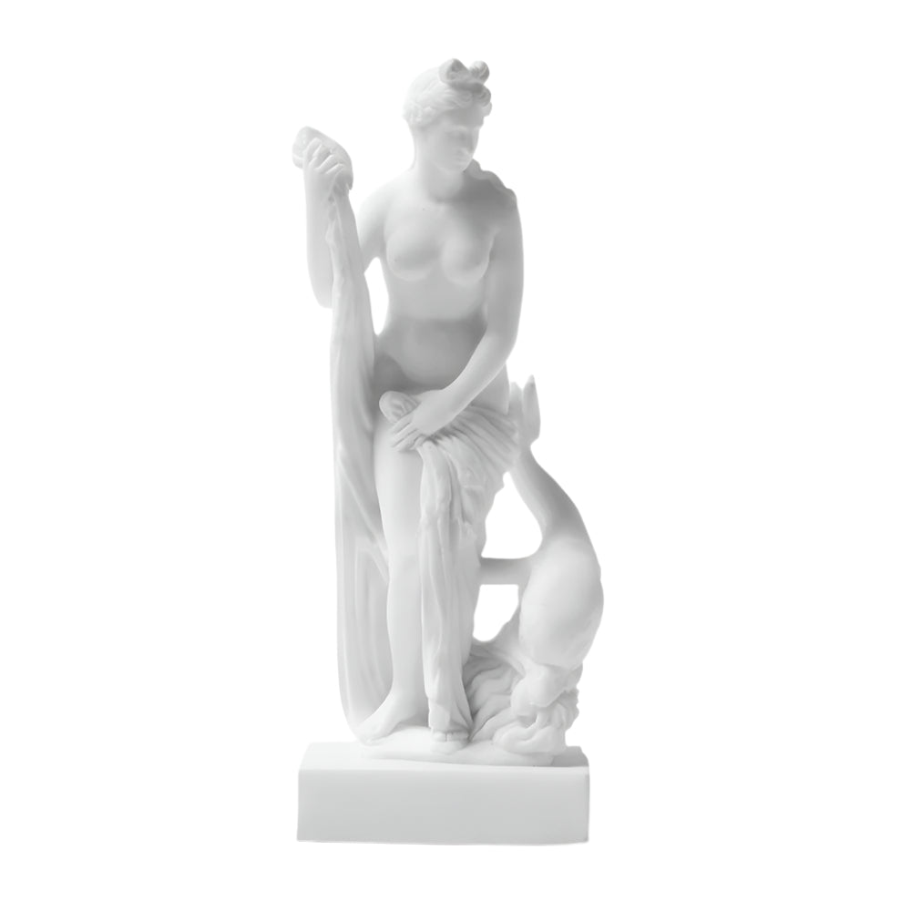 A white statue of Venus with a dolphin at her feet, representing the goddess of love from Roman and Greek mythology.