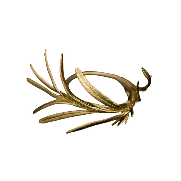 A golden napkin ring with a rosemary leaf design against a white background.