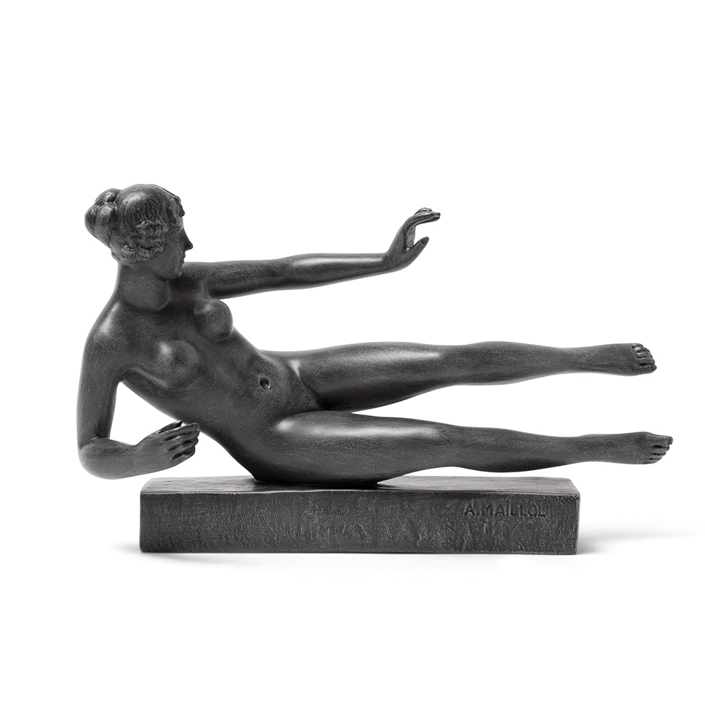 A black sculpture reproduction of Aristide Maillol's L'Air, depicting a nude female figure in a dynamic pose, resting on an imaginary center of gravity.