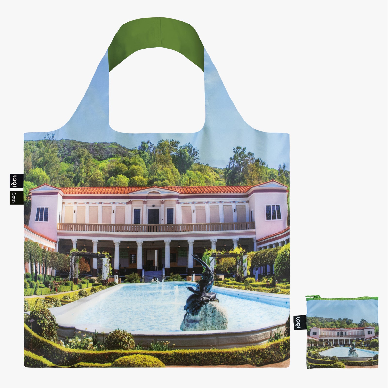 A reusable tote bag featuring an image of the Getty Villa Museum's Outer Peristyle garden, with a green handle and a multicolored building and garden scene.